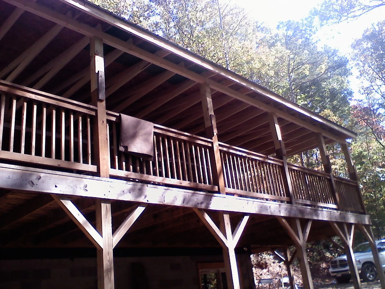 Timber framing under a new elevated porch and deck — Roof Leak Repair in McMinnville by Roofing Brothers